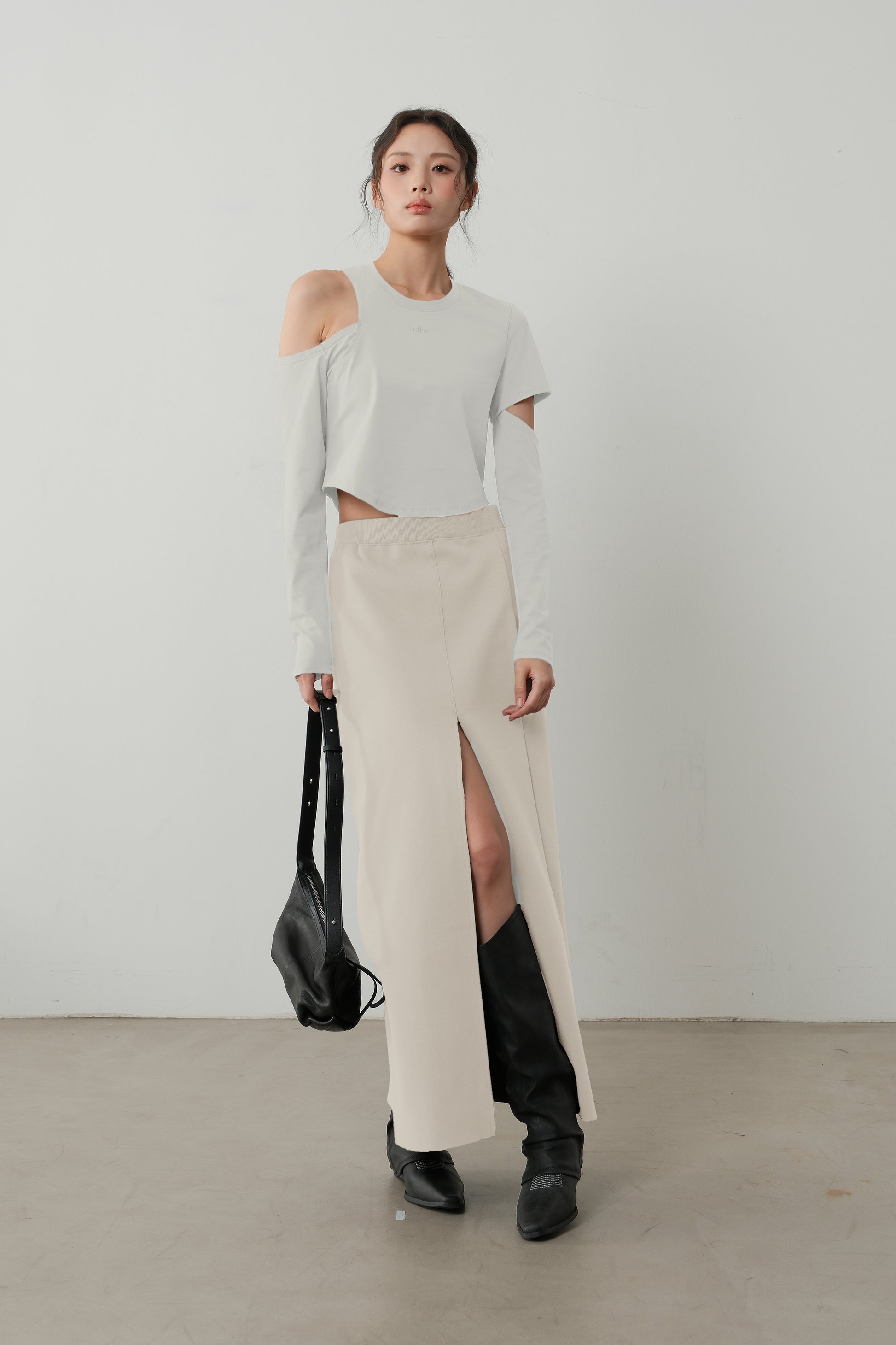 Front pose of The Linear Side Split Skirt in Fog, emphasizing its clean lines and modern silhouette.