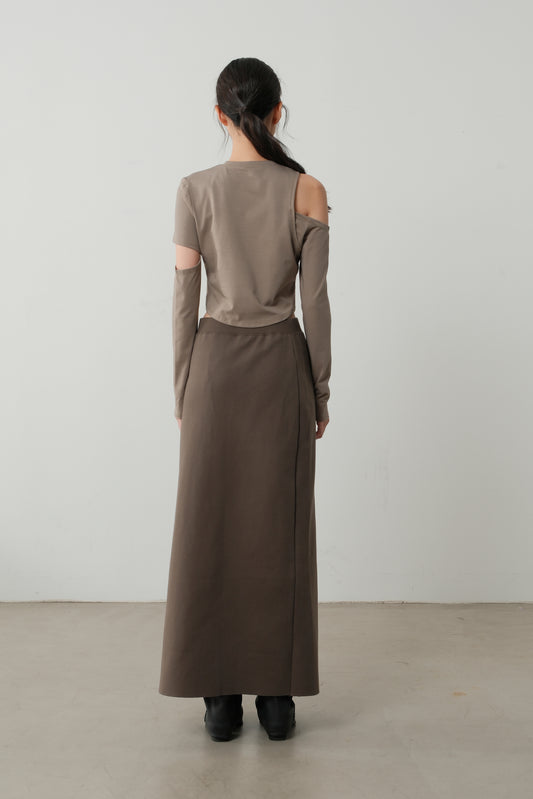 Rear angle highlighting the long column fit of The Linear Side Split Skirt.