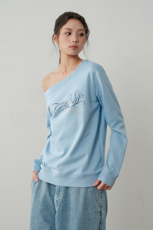 Side view of The Lethe One Shoulder Sweatshirt in Icy Blue showing off-shoulder neckline and minimalist line-art print.